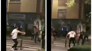 Macrobaralla amb pals, martells i botelles en la plaça Hondures de València